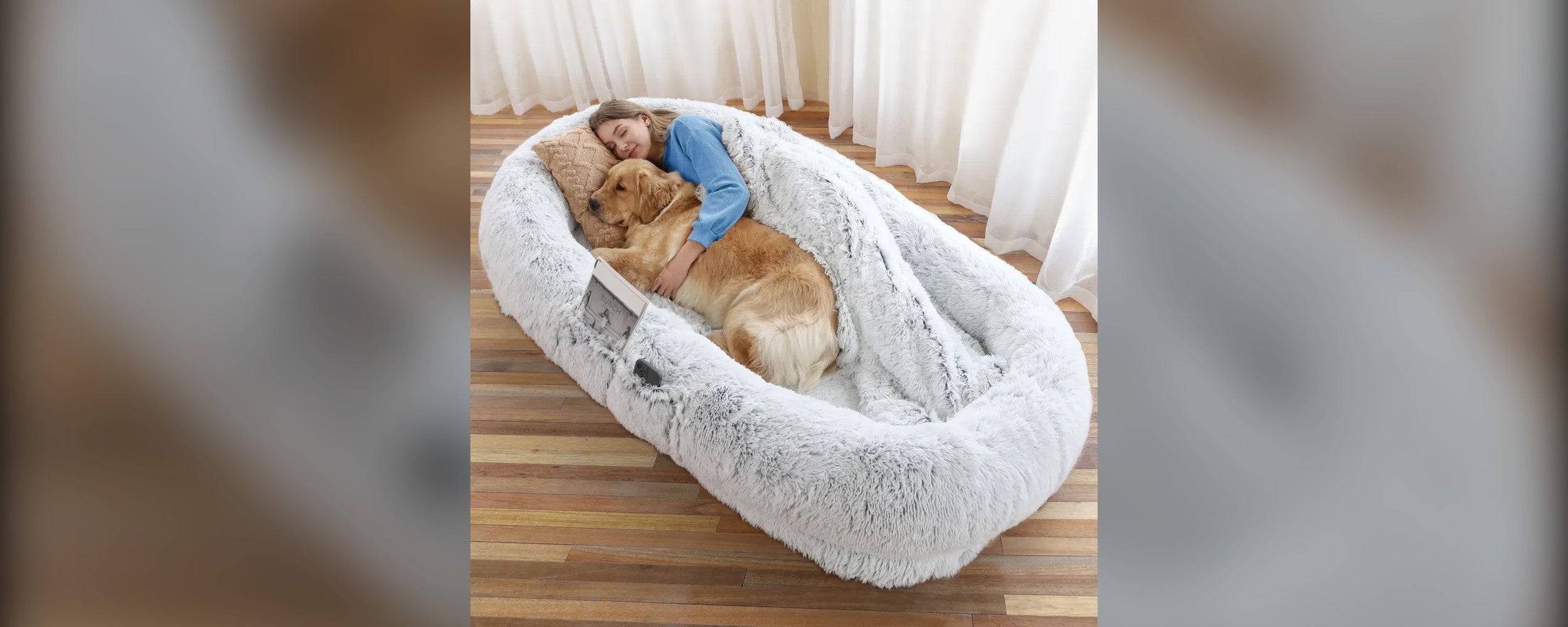 SnugHound Human Dog Bed wide hero - person and golden retriever in gray lounger